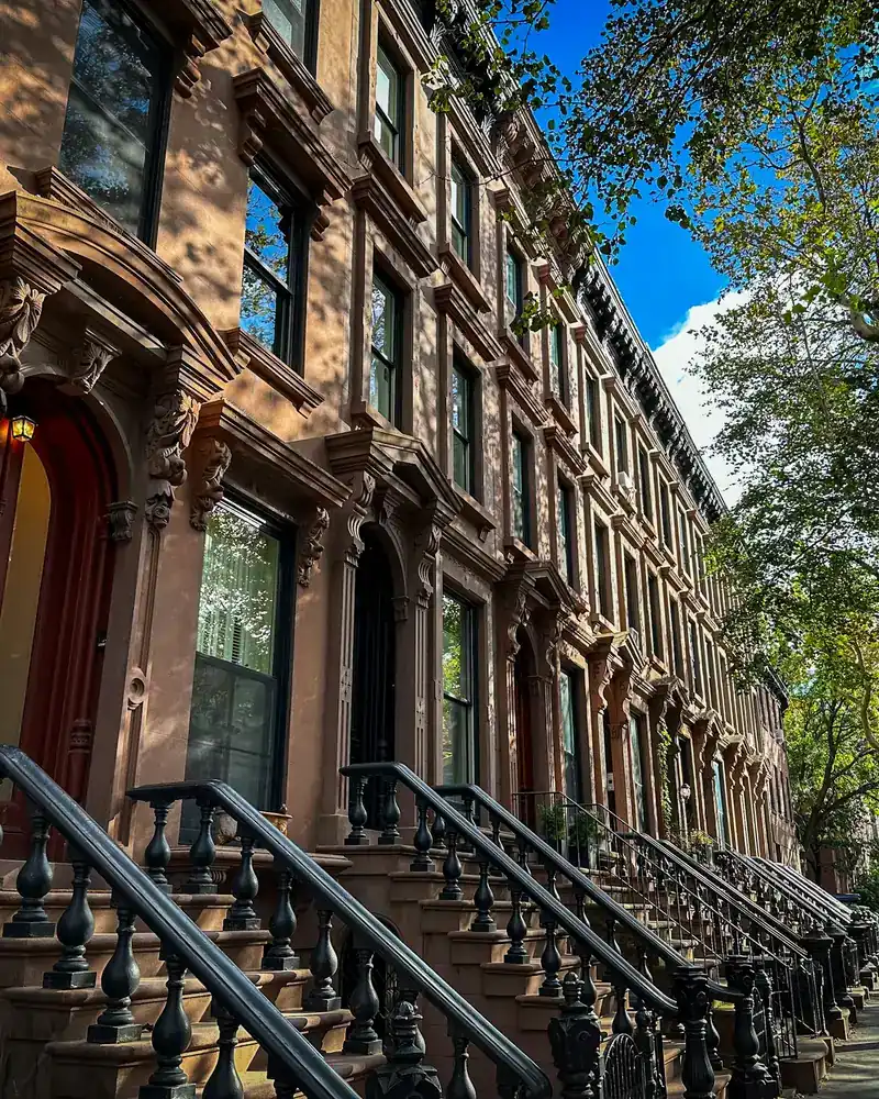 Brownstone row houses on a Brooklyn block